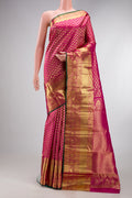 Rani Pink Kanchipuram Silk Saree with Zari Brocade on the body and Zari Border.  displayed on a mannequin