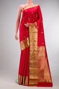 Red Kanchipuram Silk Saree with Zari Butta on the body and Zari Border.  displayed on a mannequin