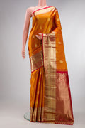 Pure Silk Mustard Kanchipuram Saree with Zari Butta on the body and Zari Border.  displayed on a mannequin