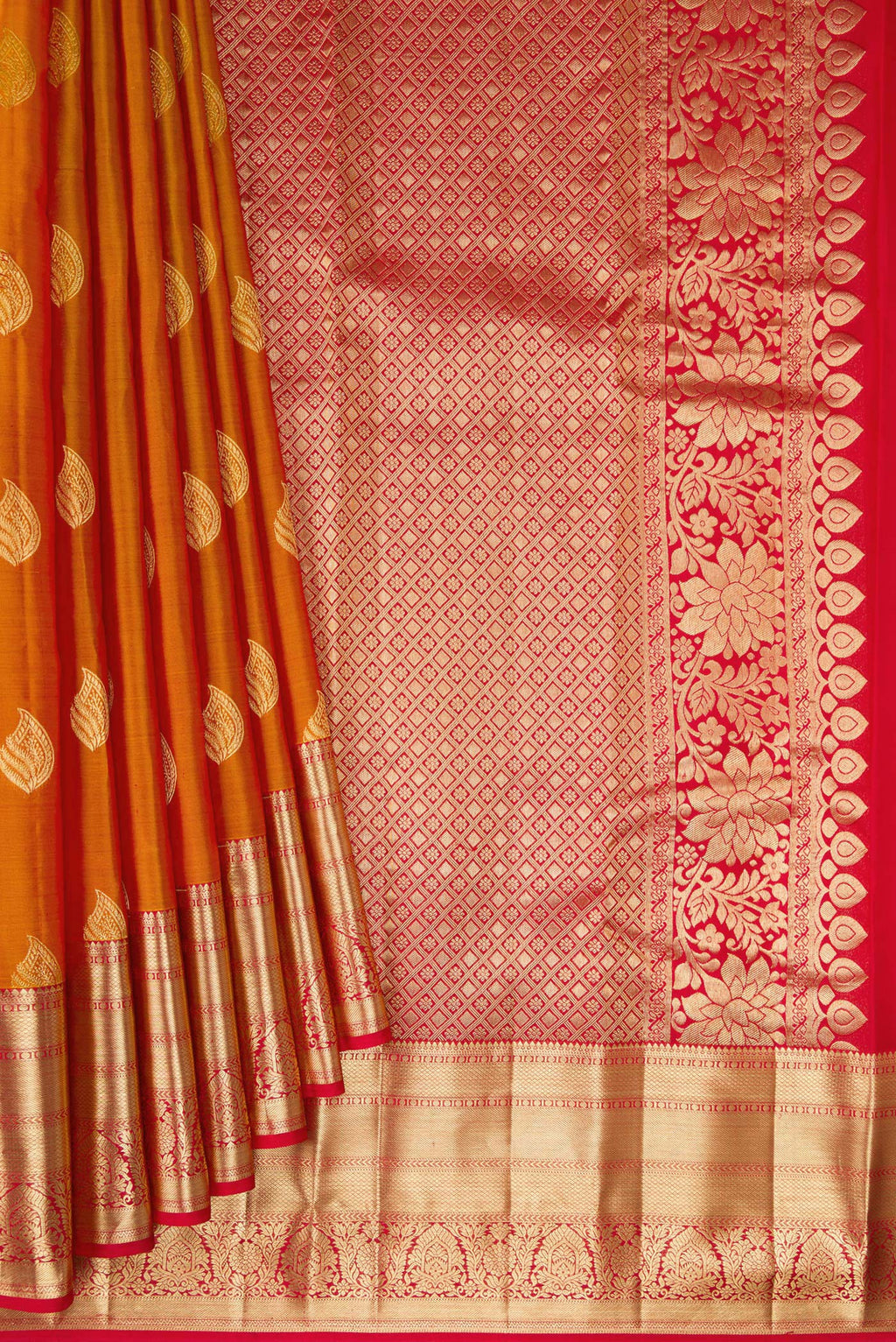 Pleats and pallu of Pure Silk Mustard Kanchipuram Saree with Zari Butta on the body and Zari Border. 