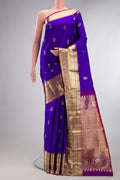 Pure Silk Royal Blue Kanchipuram Saree with Zari Butta on the body and Zari Border.  displayed on a mannequin