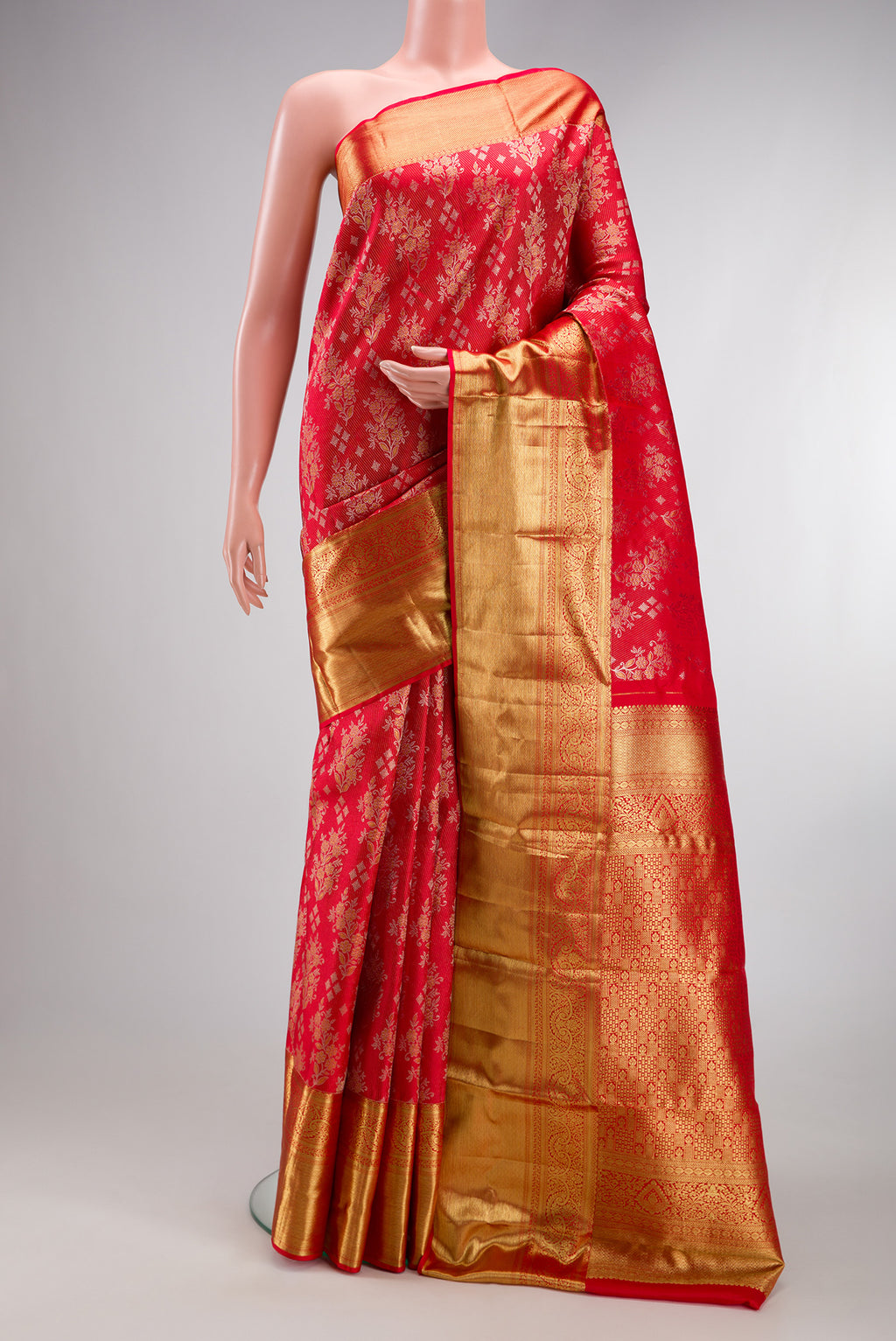 Red Kanjivaram Silk Saree with Zari Brocade on the body and Zari Border.  displayed on a mannequin