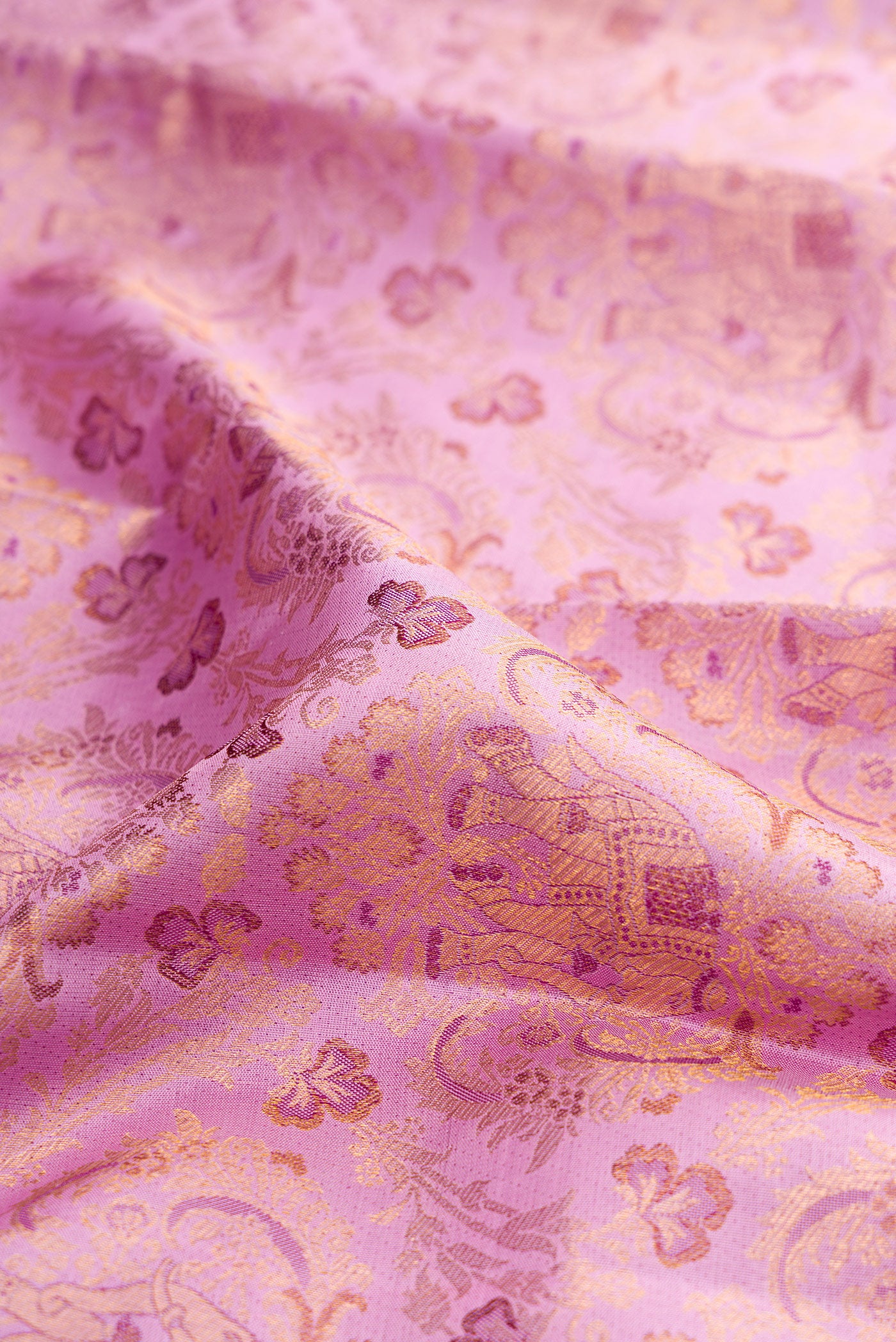 Close up of Lavender Kanjivaram Silk Saree with Zari Brocade on the body and Zari Border.  displaying folds