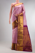 Lavender Kanjivaram Silk Saree with Zari Brocade on the body and Zari Border.  displayed on a mannequin