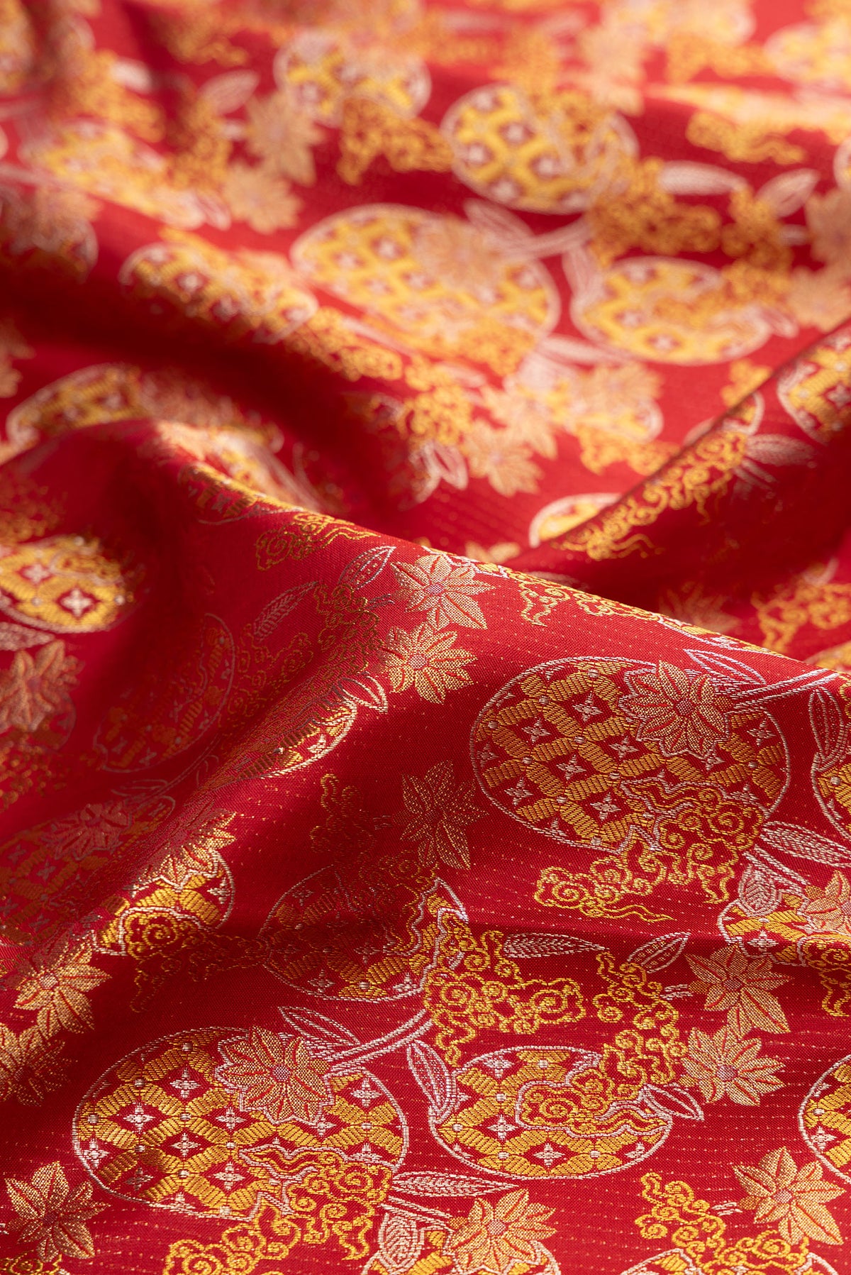 Close up of Maroon Kanjivaram Silk Saree with Zari Brocade on the body and Zari Border.  displaying folds
