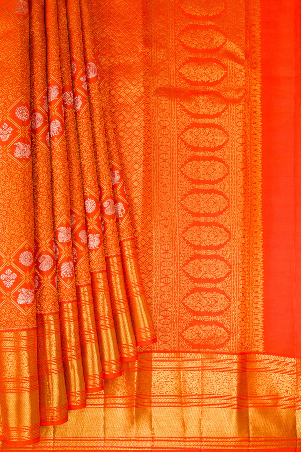 Pleats and pallu of Orange Kanjivaram Silk Saree with Zari Brocade on the body and Zari Border. 