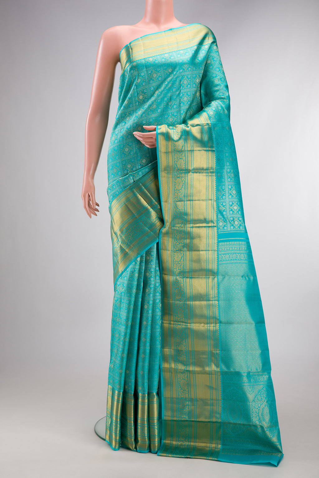 Sky Blue Kanjivaram Silk Saree with Zari Brocade on the body and Zari Border.  displayed on a mannequin