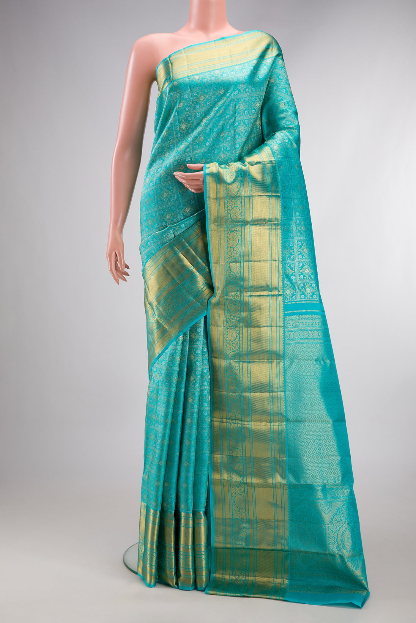 Sky Blue Kanjivaram Silk Saree with Zari Brocade on the body and Zari Border.  displayed on a mannequin