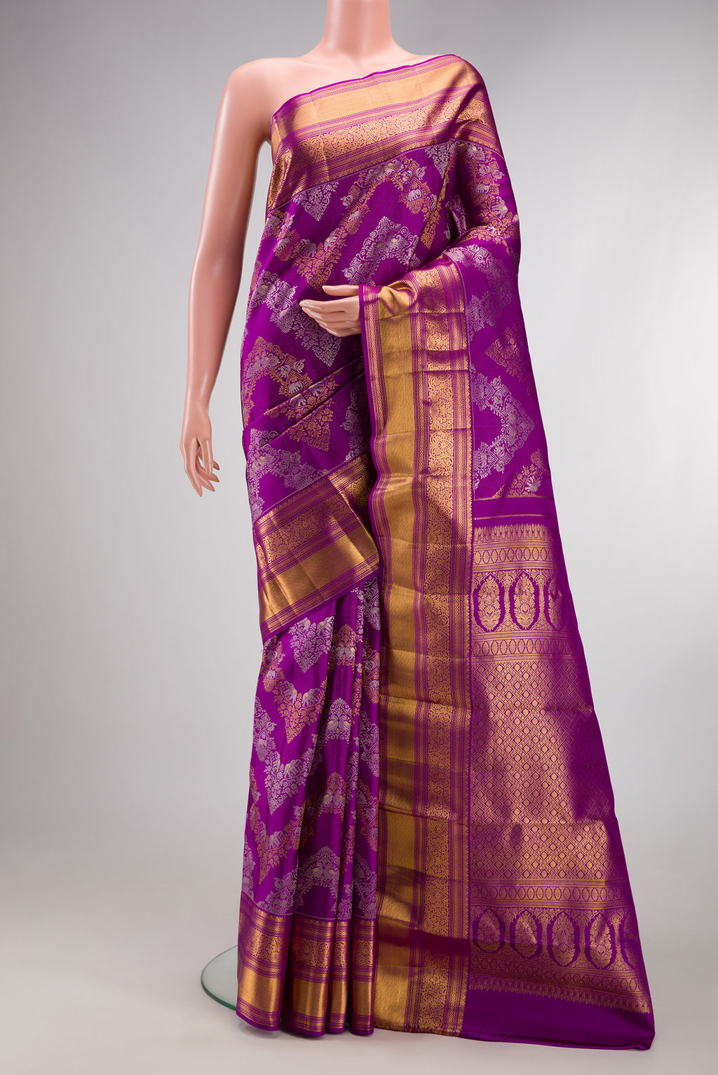 Pure Silk Purple Kanjivaram Saree with Zari Brocade on the body and Zari Border.  displayed on a mannequin