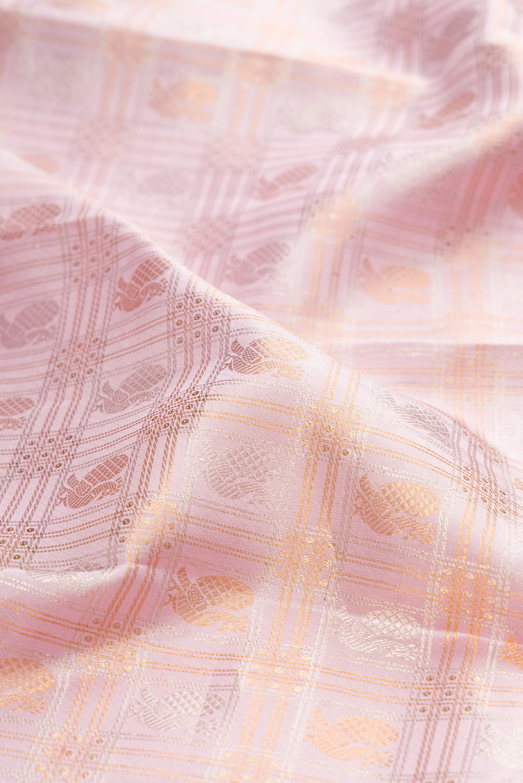 Close up of Lilac Kanjivaram Silk Saree with Checked design on the body and Zari Border.  displaying folds