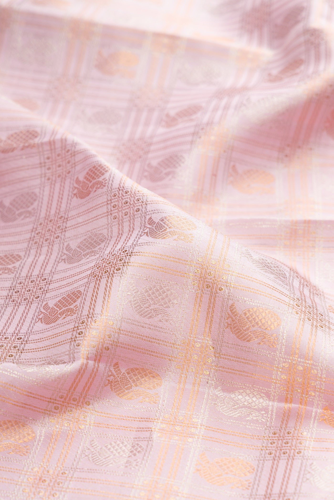 Close up of Lilac Kanjivaram Silk Saree with Checked design on the body and Zari Border.  displaying folds