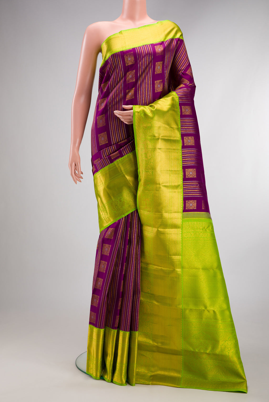 Pure Silk Purple Kanjivaram Saree with Zari Brocade on the body and Zari Border.  displayed on a mannequin
