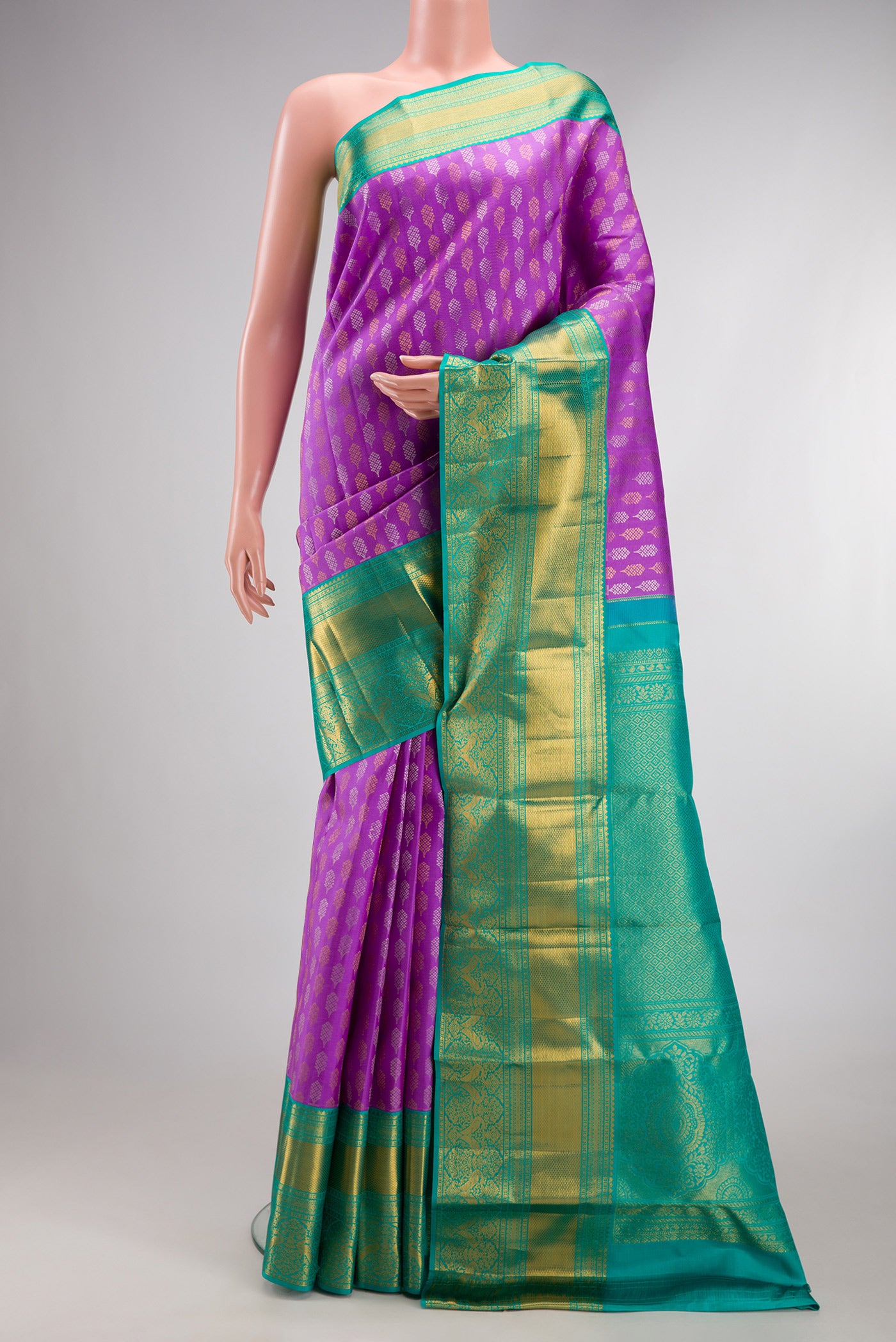 Pure Silk Lavender Kanjivaram Saree with Zari Brocade on the body and Zari Border.  displayed on a mannequin