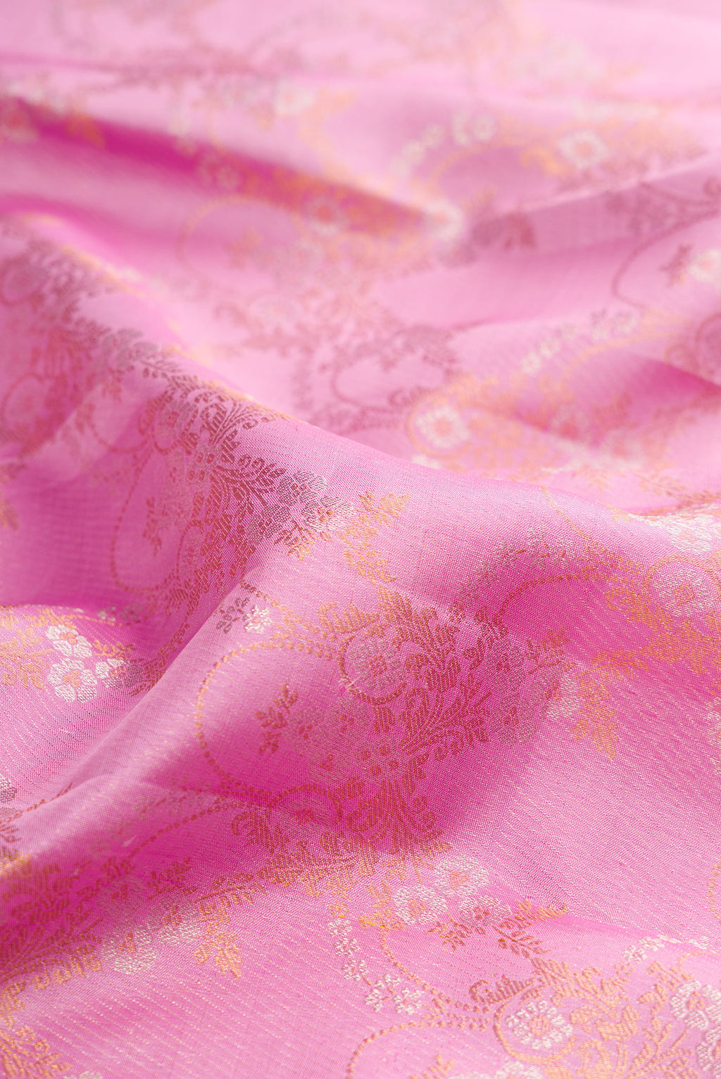 Close up of Pure Silk Pink Kanjivaram Saree with Zari Brocade on the body and Zari Border.  displaying folds