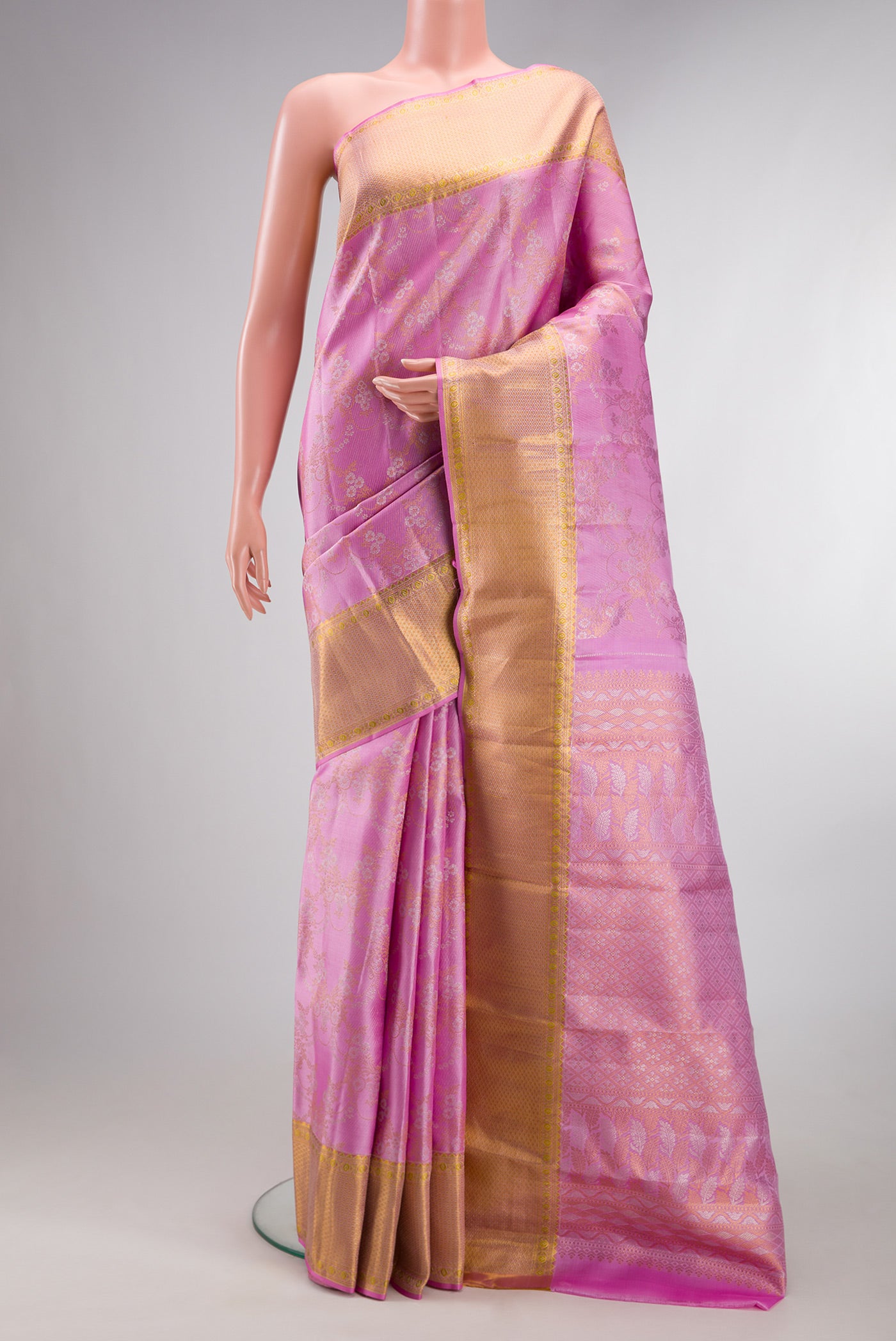 Pure Silk Pink Kanjivaram Saree with Zari Brocade on the body and Zari Border.  displayed on a mannequin