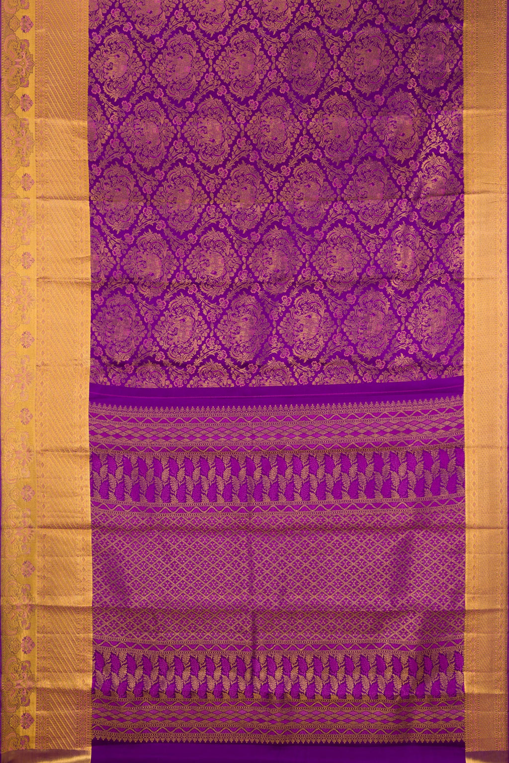 Flat view of Purple Kanjivaram Silk Saree with Zari Brocade on the body and Zari Border. 