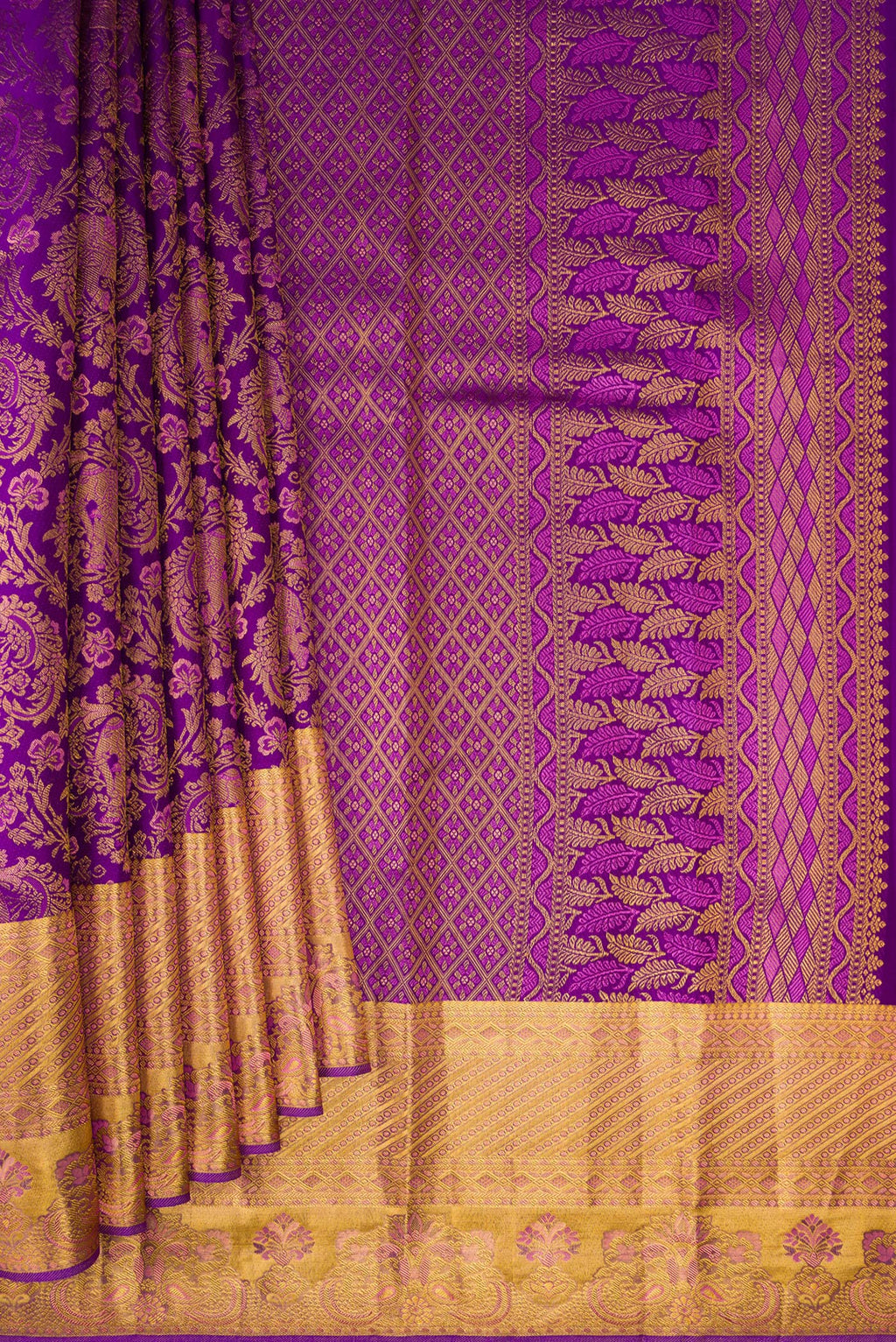 Pleats and pallu of Purple Kanjivaram Silk Saree with Zari Brocade on the body and Zari Border. 