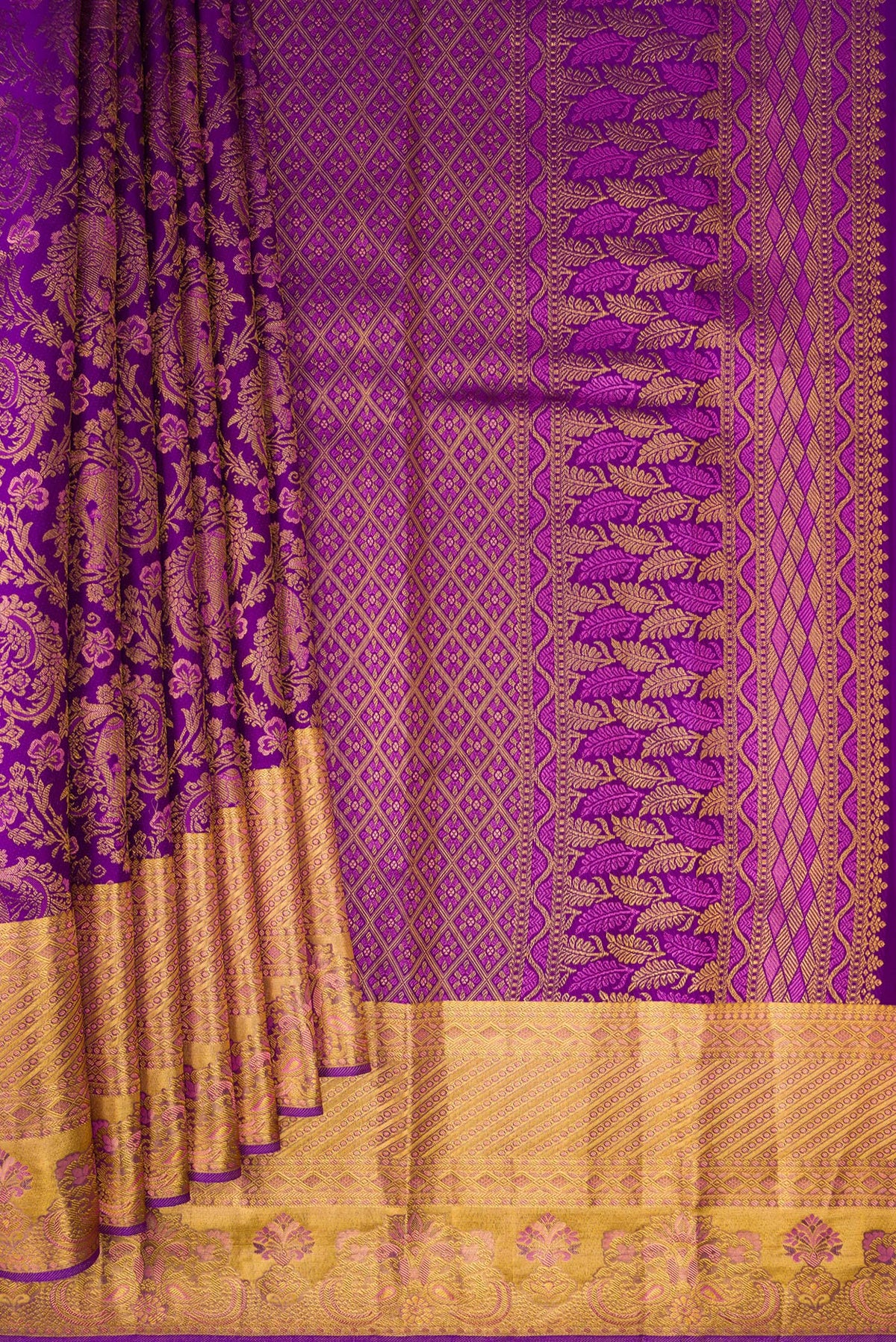 Pleats and pallu of Purple Kanjivaram Silk Saree with Zari Brocade on the body and Zari Border. 