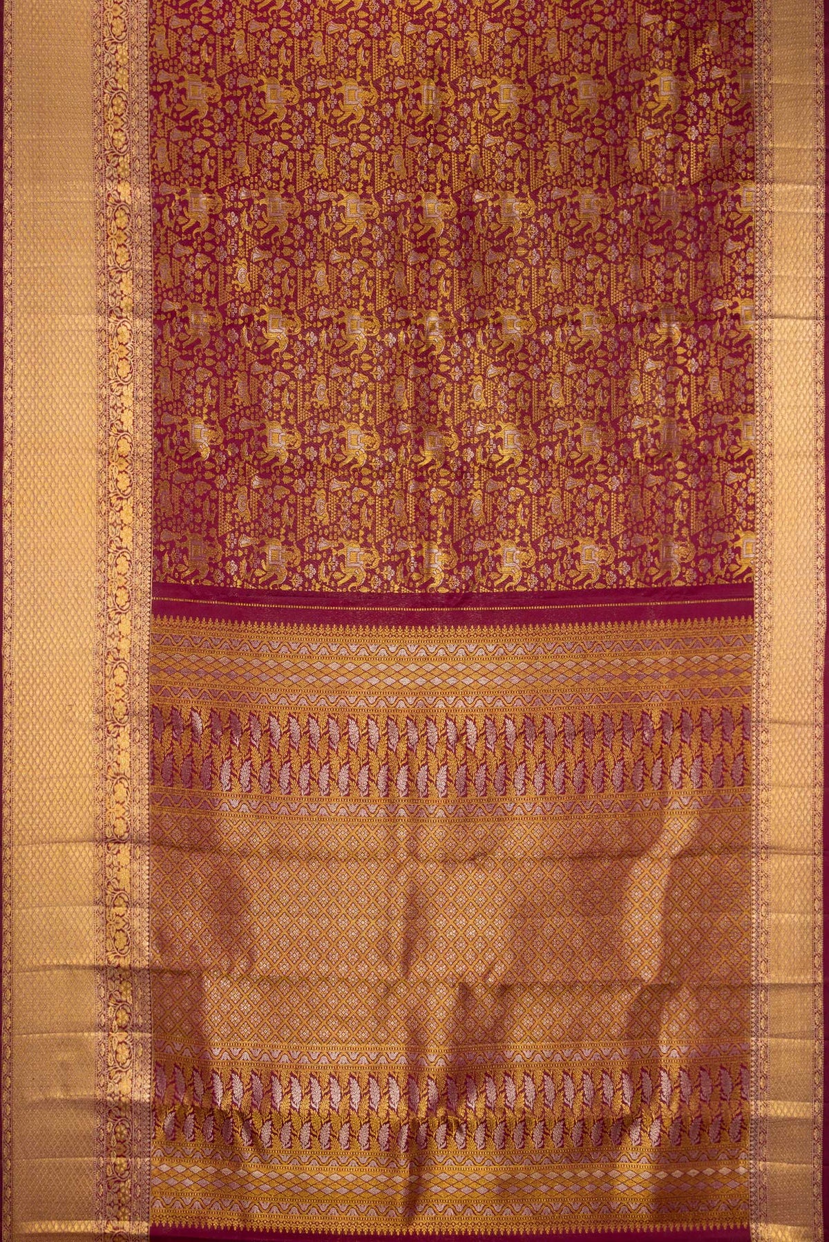 Flat view of Pure Silk Maroon Kanjivaram Saree with Zari Brocade on the body and Zari Border. 