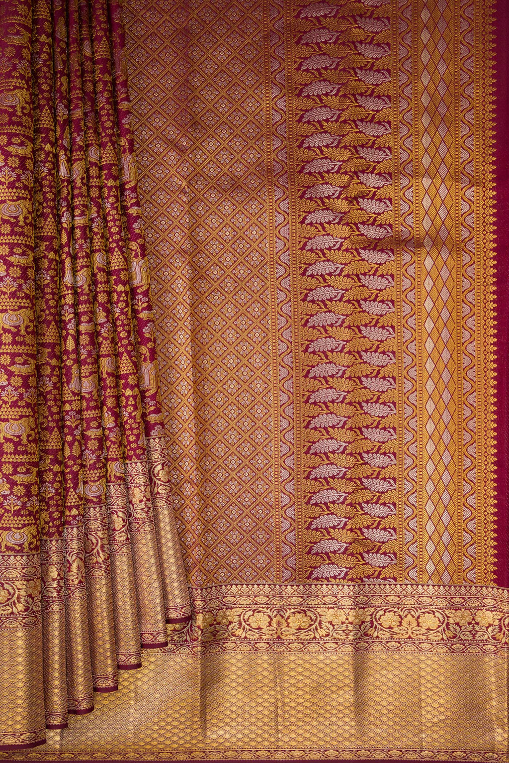 Pleats and pallu of Pure Silk Maroon Kanjivaram Saree with Zari Brocade on the body and Zari Border. 