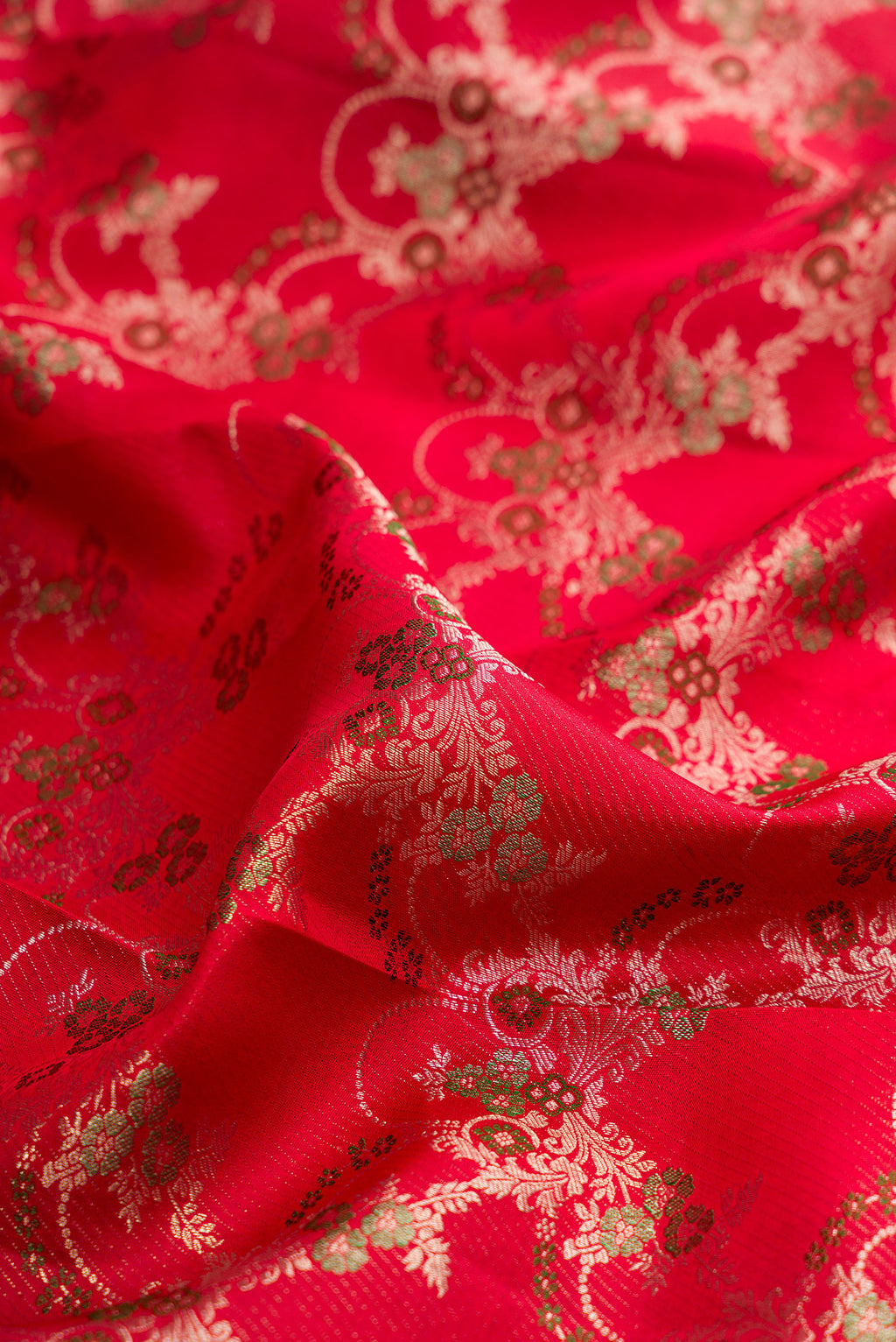 Close up of Pure Silk Red Kanjivaram Saree with Zari Brocade on the body and Fancy Border.  displaying folds