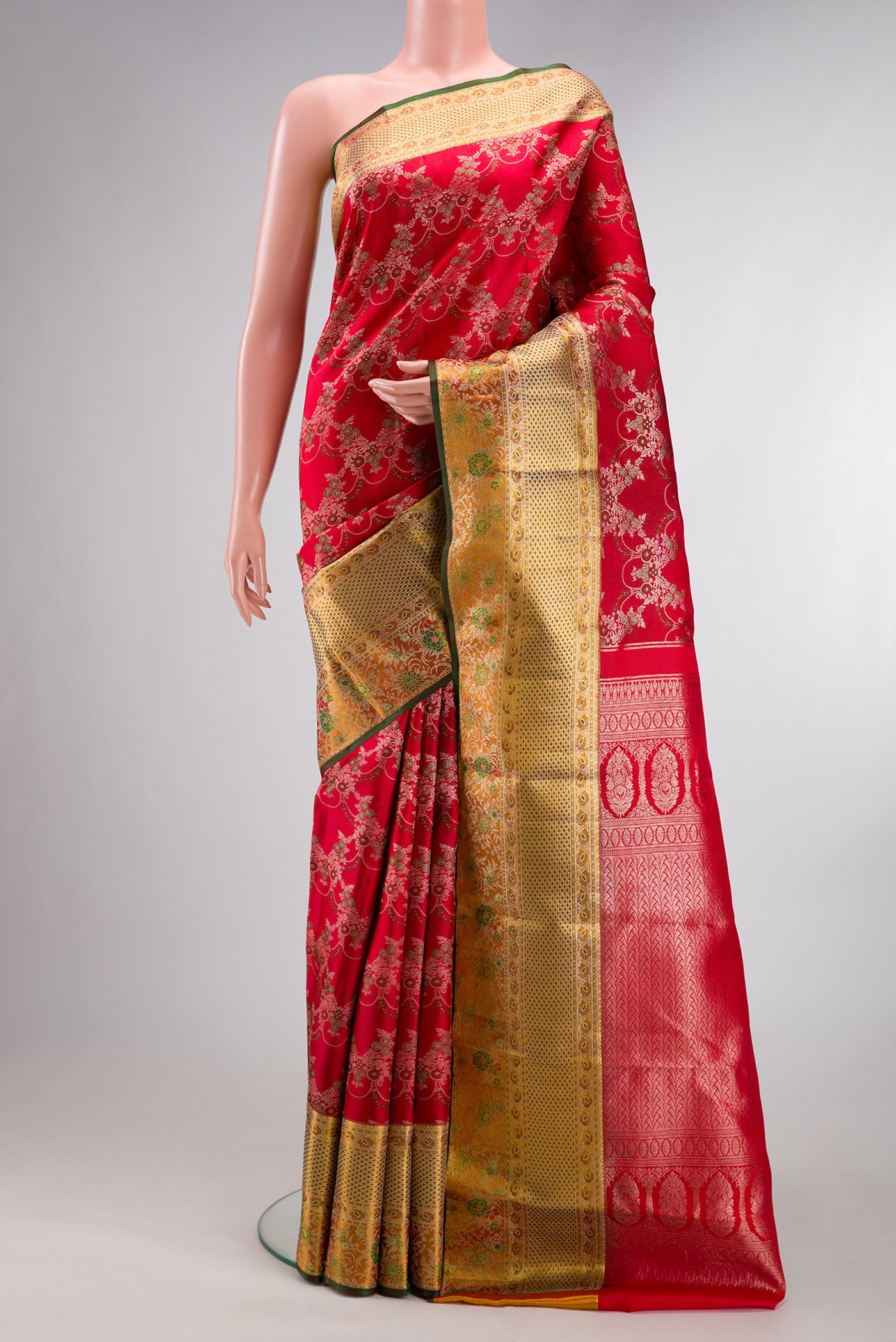 Pure Silk Red Kanjivaram Saree with Zari Brocade on the body and Fancy Border.  displayed on a mannequin