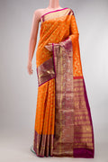 Pure Silk Orange Kanjivaram Saree with Zari Brocade on the body and Fancy Border.  displayed on a mannequin
