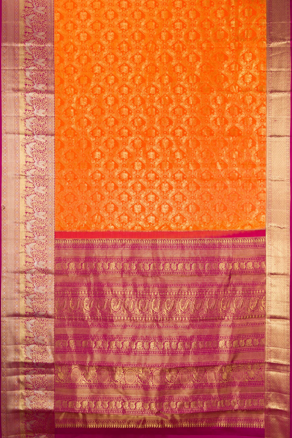 Flat view of Pure Silk Orange Kanjivaram Saree with Zari Brocade on the body and Fancy Border. 