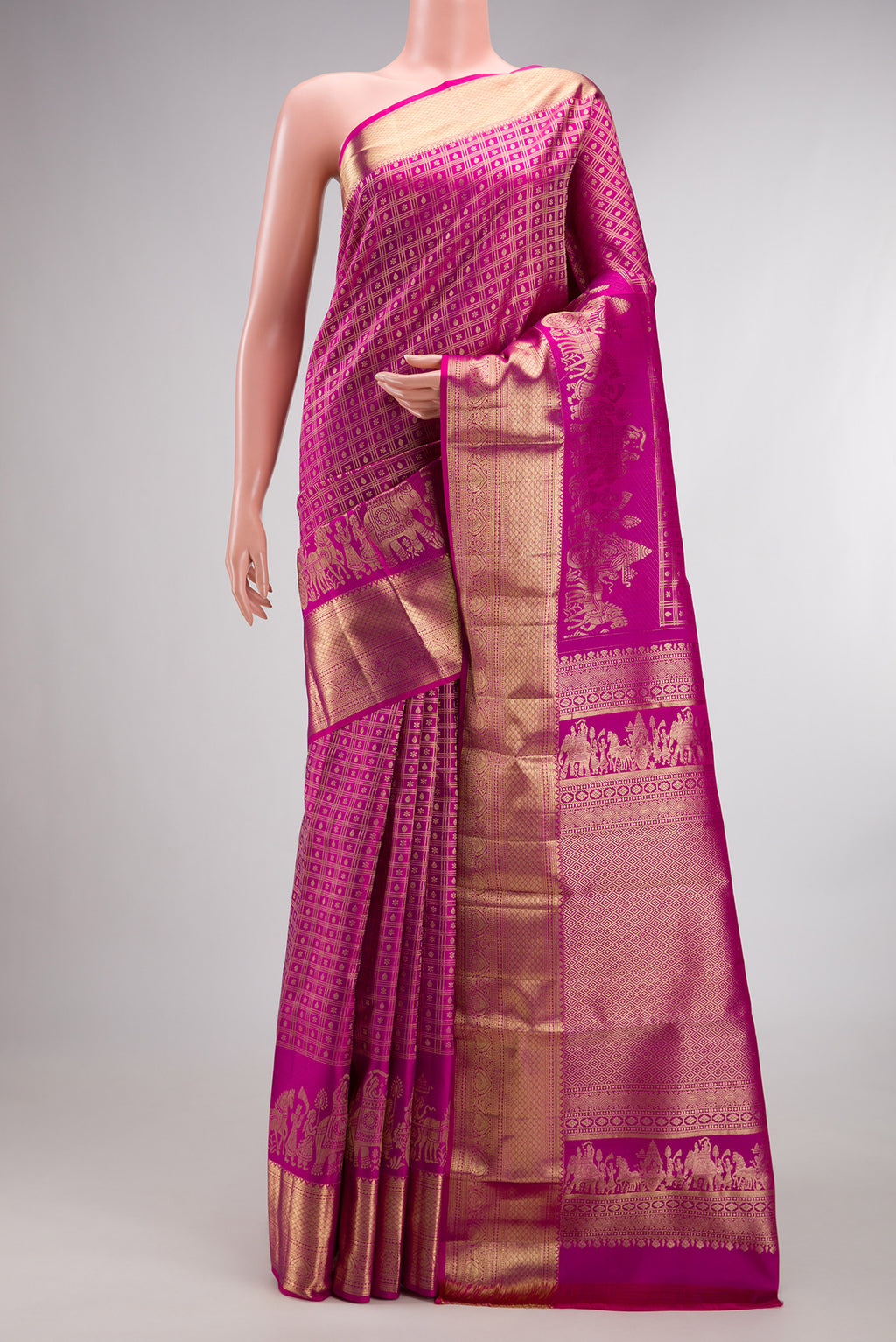 Pure Silk Rani Pink Kanchipuram Saree with Zari Brocade on the body and Fancy Border.  displayed on a mannequin