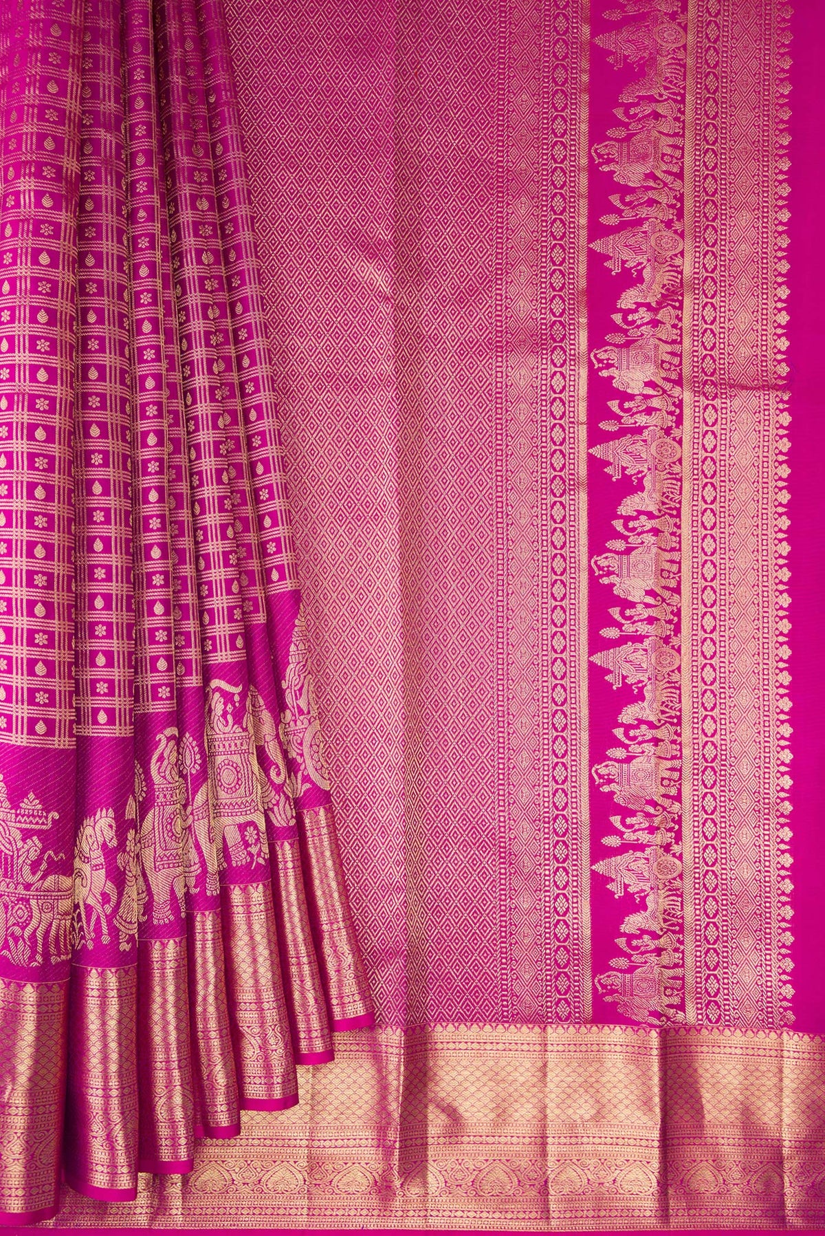 Pleats and pallu of Pure Silk Rani Pink Kanchipuram Saree with Zari Brocade on the body and Fancy Border. 