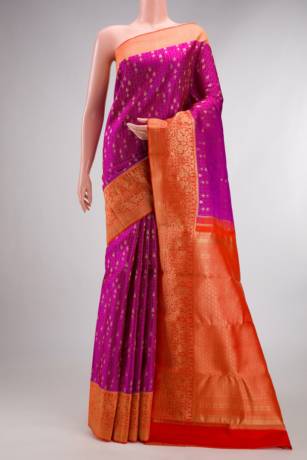 Pure Silk Magenta Kanchipuram Saree with Zari Brocade on the body and Fancy Border.  displayed on a mannequin