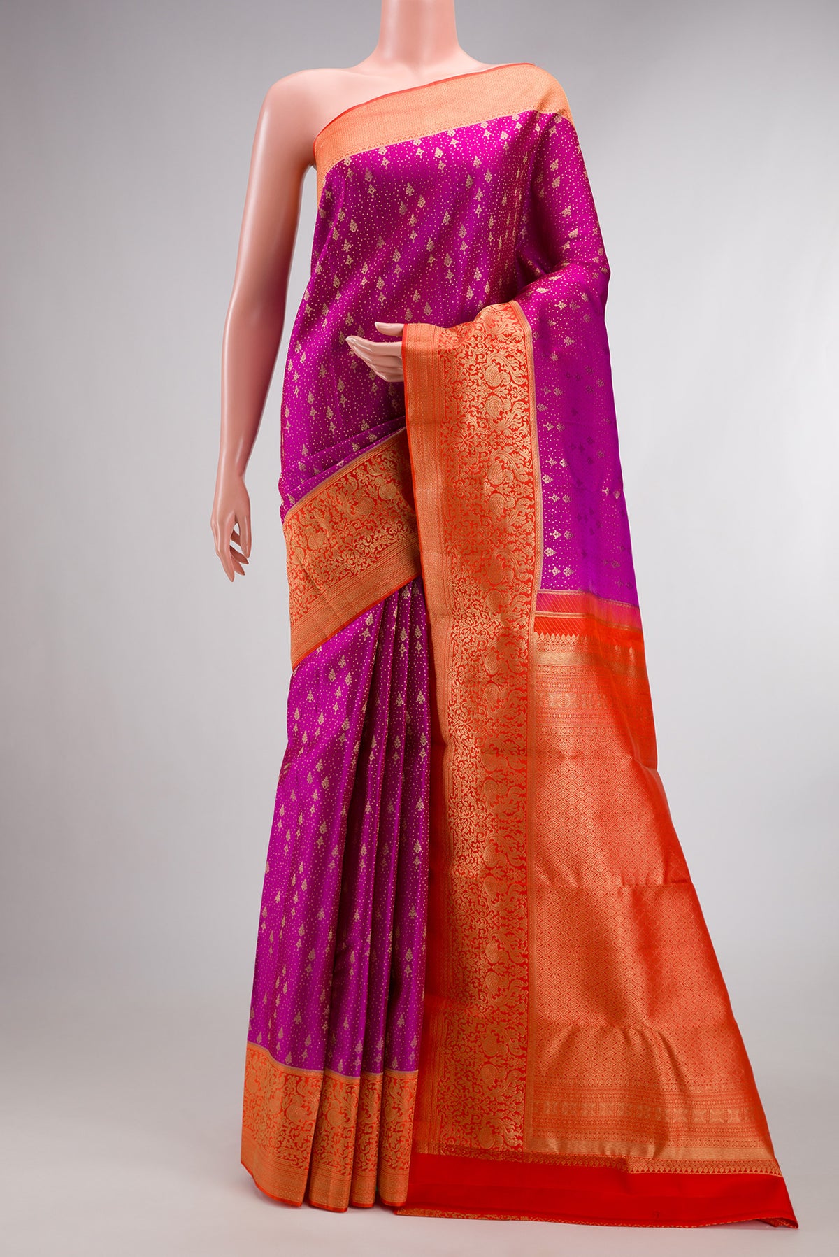 Pure Silk Magenta Kanchipuram Saree with Zari Brocade on the body and Fancy Border.  displayed on a mannequin
