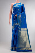 Pure Silk Peacock Blue Kanchipuram Saree with Zari Butta on the body and Fancy Border.  displayed on a mannequin