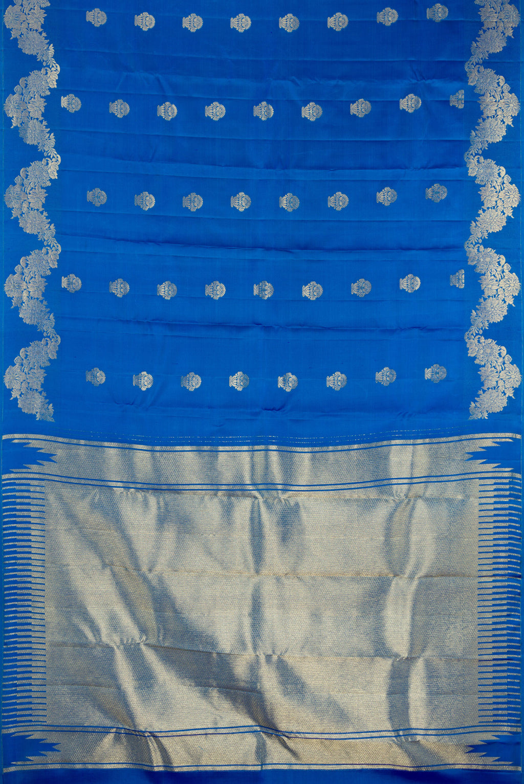 Flat view of Pure Silk Peacock Blue Kanchipuram Saree with Zari Butta on the body and Fancy Border. 
