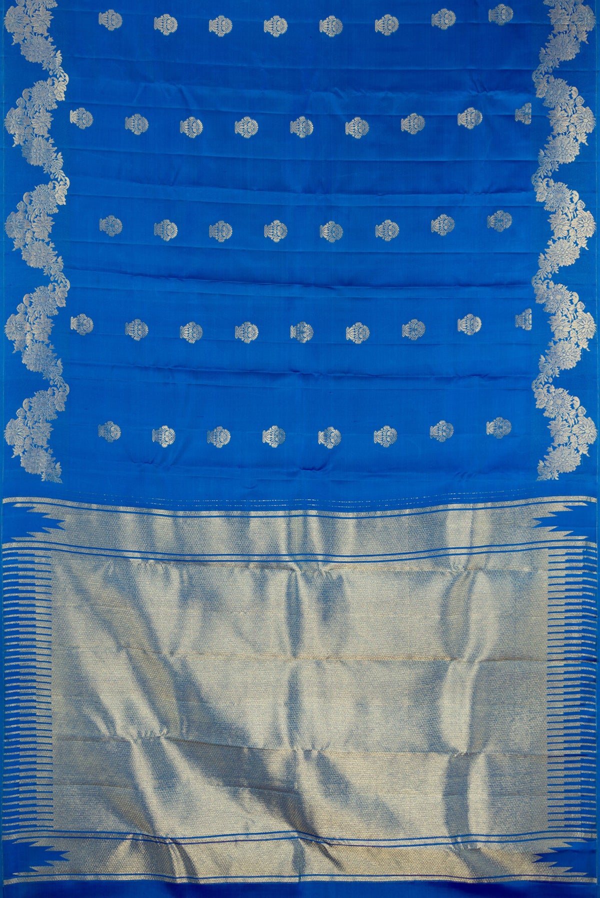 Flat view of Pure Silk Peacock Blue Kanchipuram Saree with Zari Butta on the body and Fancy Border. 