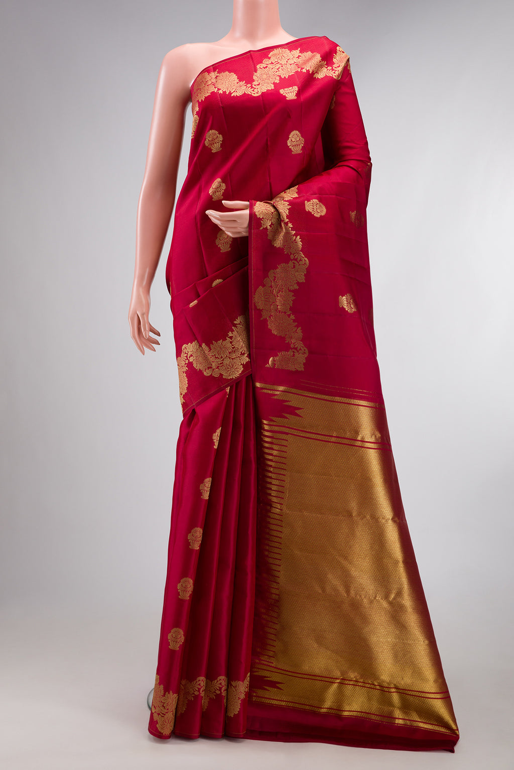 Pure Silk Maroon Kanchipuram Saree with Zari Butta on the body and Fancy Border.  displayed on a mannequin