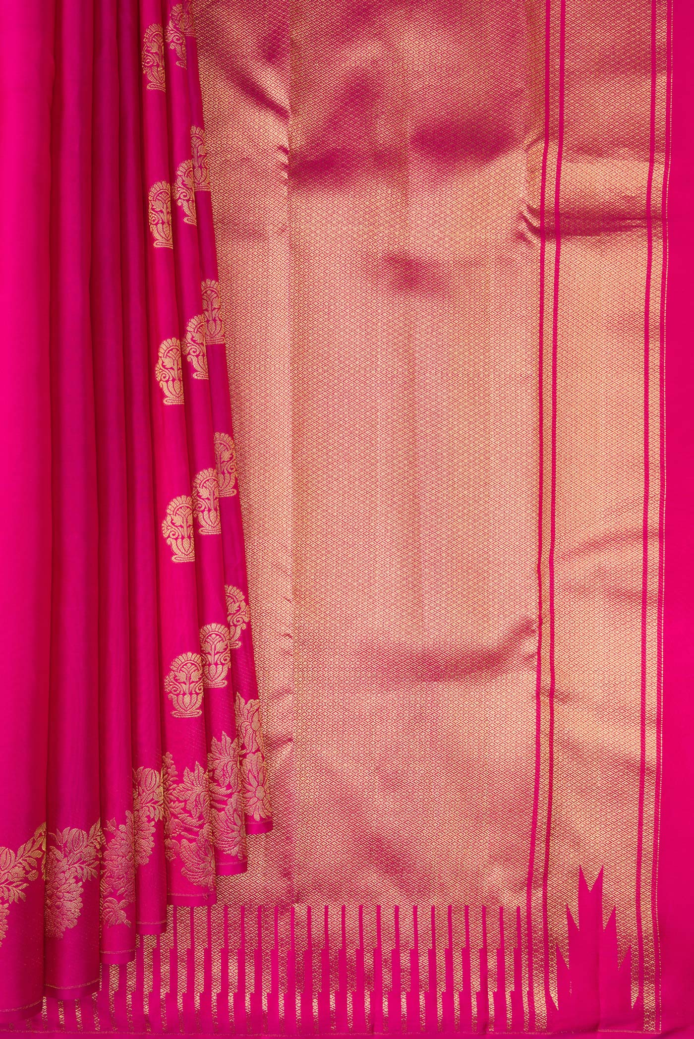 Pleats and pallu of Pure Silk Rani Pink Kanchipuram Saree with Zari Butta on the body and Fancy Border. 