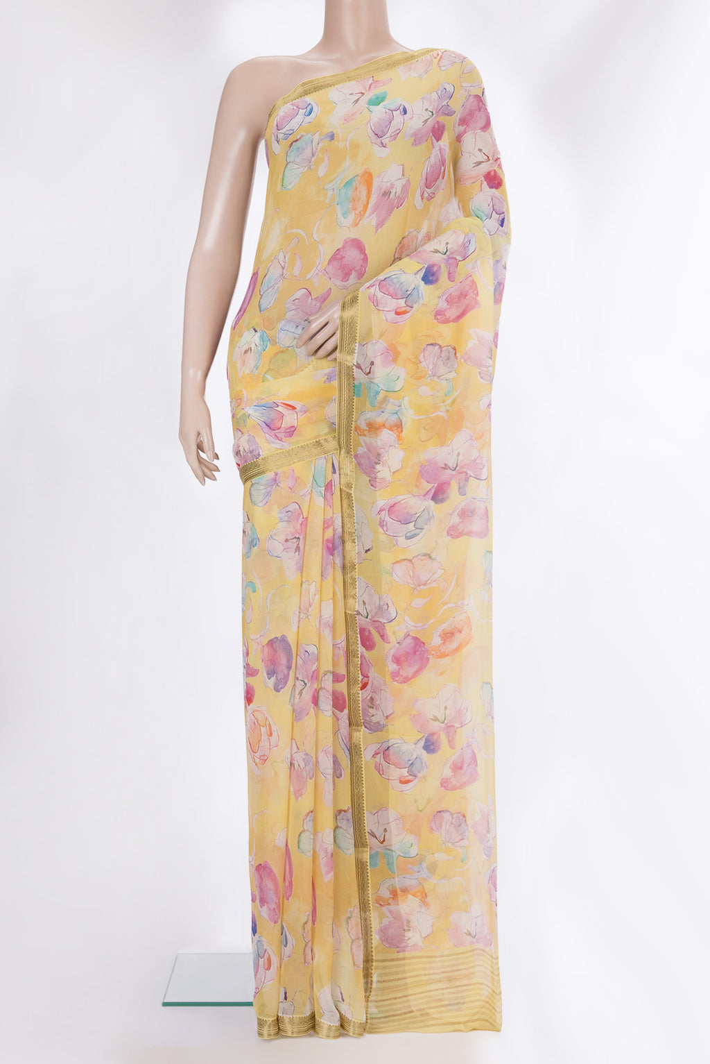 Yellow Mysore Chiffon Saree with Printed design on the body and Zari Border.  displayed on a mannequin