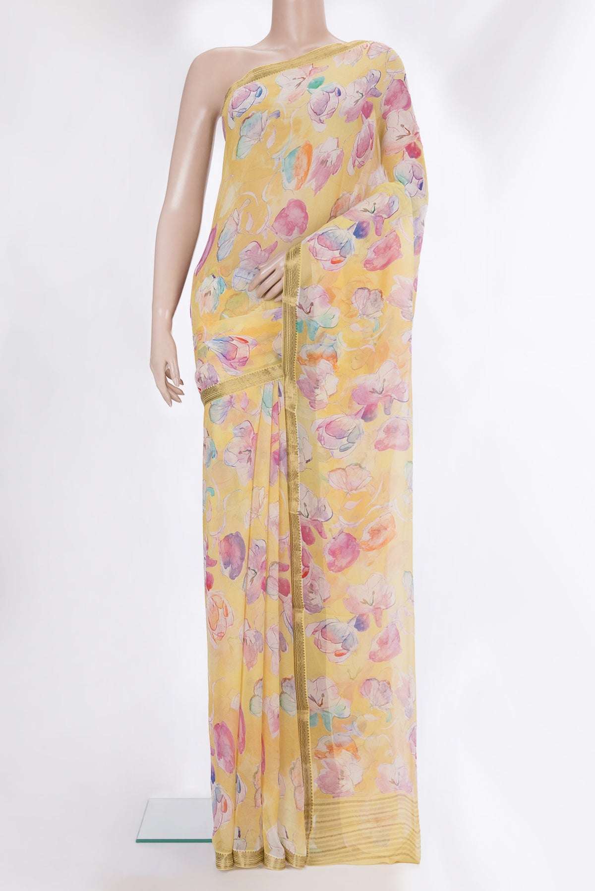 Yellow Mysore Chiffon Saree with Printed design on the body and Zari Border.  displayed on a mannequin