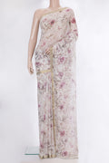 Beige Dual Tone Chiffon Saree with Printed design on the body and Zari Border.  displayed on a mannequin