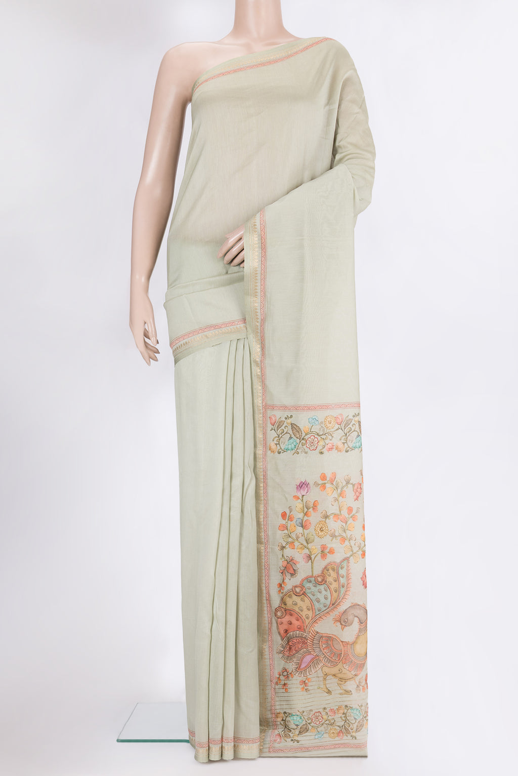 Pista Green Chanderi Silk Cotton Saree with Plain Body and Zari Border.  displayed on a mannequin
