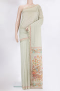 Pista Green Chanderi Silk Cotton Saree with Plain Body and Zari Border.  displayed on a mannequin