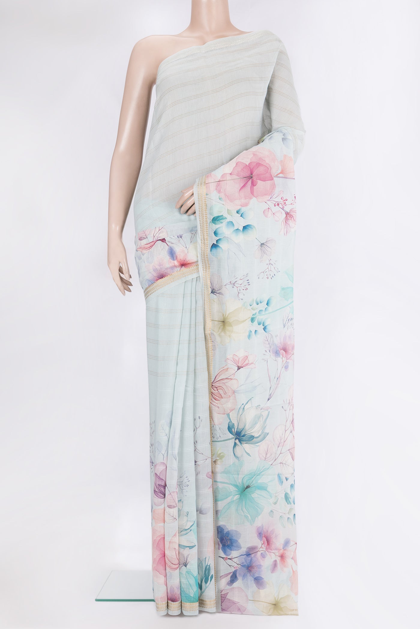 Light Blue Chanderi Silk Cotton Saree with Printed design on the body and Zari Border.  displayed on a mannequin
