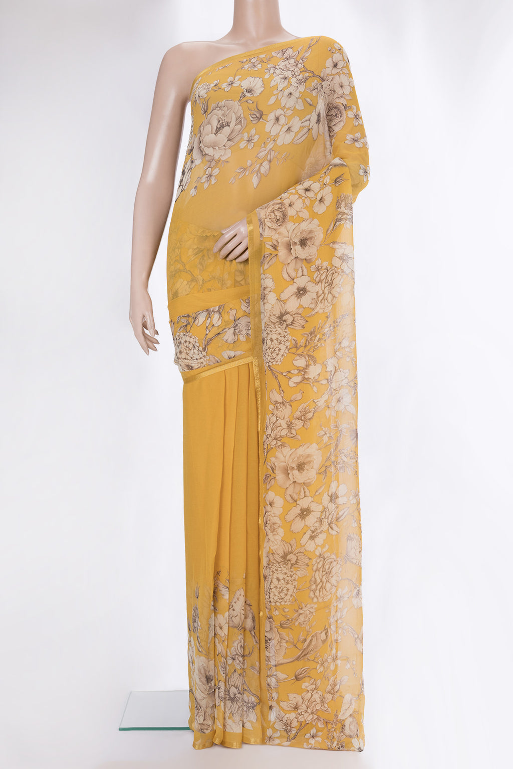 Mustard Mysore Chiffon Saree with Floral Print on the body and Zari Border.  displayed on a mannequin