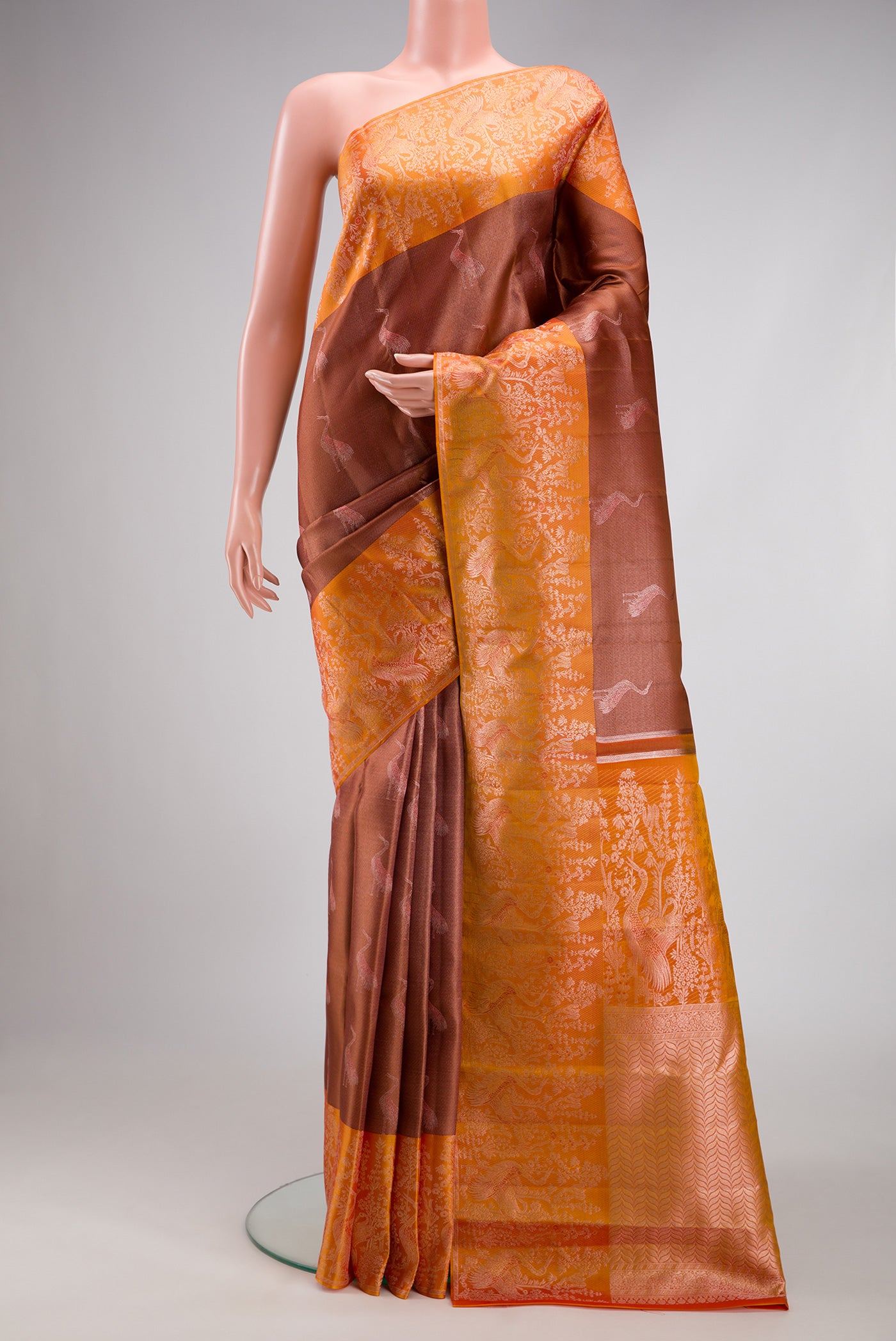 Rose Gold Dual Tone Kanchipuram Tissue Silk Saree with Zari Brocade on the body and Fancy Border.  displayed on a mannequin