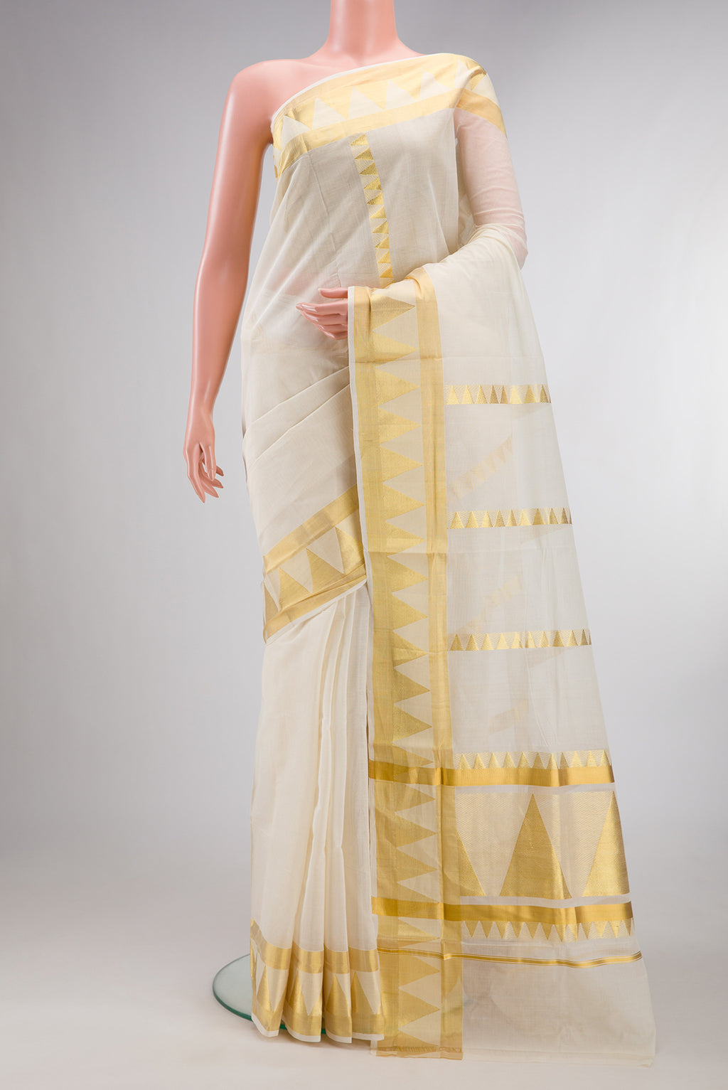 Pure Silk Off White Kerala Cotton Saree with Stripes on the body and Zari Border.  displayed on a mannequin
