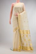 Off White Kerala Cotton Saree with Zari Butta on the body and Zari Border.  displayed on a mannequin