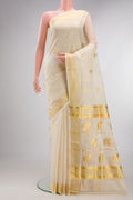 Pure Silk Off White Kerala Cotton Saree with Zari Butta on the body and Zari Border.  displayed on a mannequin