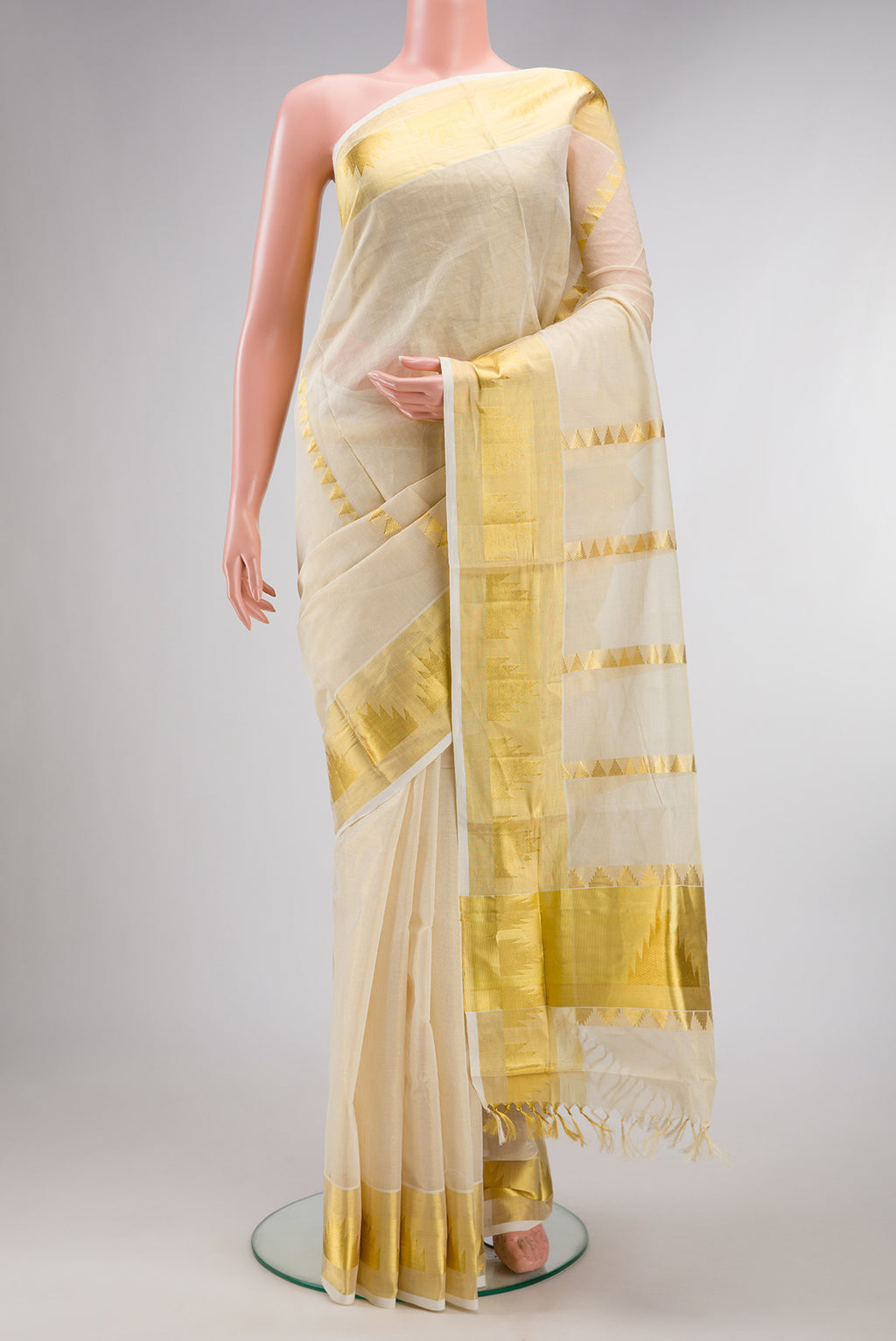 Pure Silk Off White Kerala Cotton Saree with Stripes on the body and Zari Border.  displayed on a mannequin