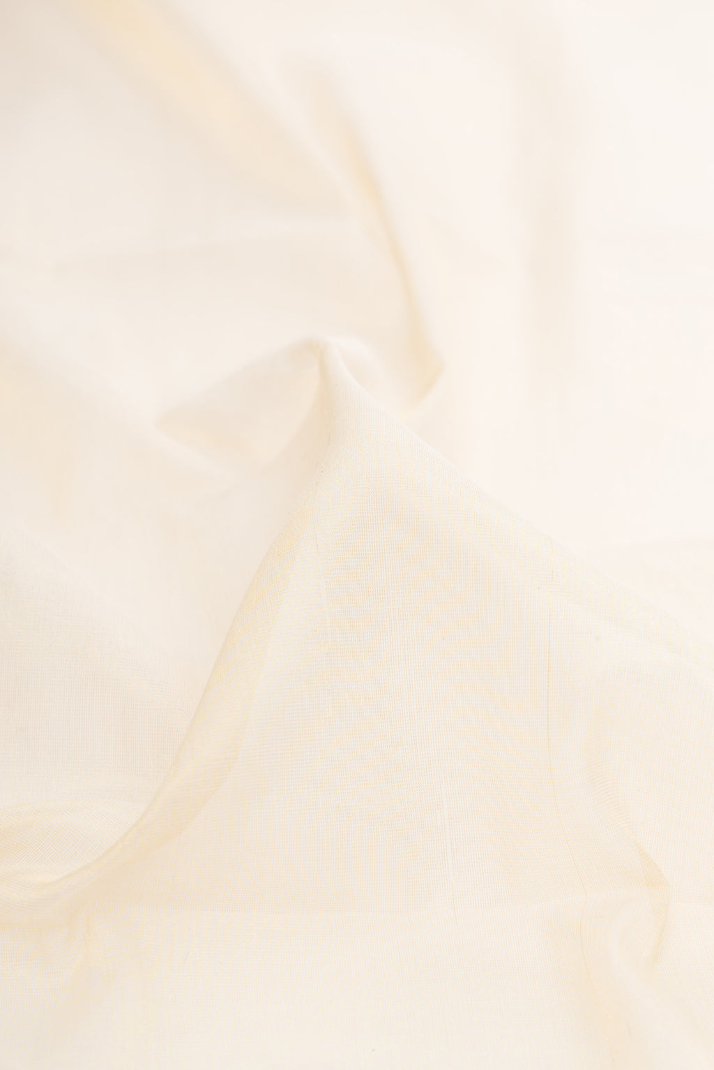 Close up of Off White Kerala Cotton Saree with Plain Body and Temple Border.  displaying folds